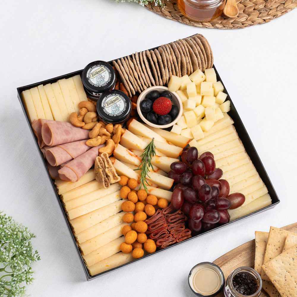 The Cheese Man Spanish Cheeseboard for 4–6 people, featuring five artisan Spanish cheeses, including Manchego, aged Iberico and rosemary sheep cheese, paired with smoked turkey salami, Spianata Piccante, crackers, grapes, nuts and gourmet preserves, Spanish cheeseboard Dubai, artisan cheese platter Dubai, Spanish cheese selection, premium charcuterie board Dubai.