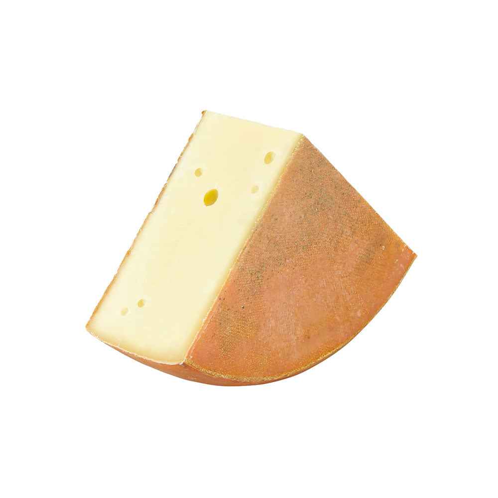 The Cheese Man Alpine mountain cheese, a semi-hard aged cheese with a firm texture and rich nutty flavour, ideal for a cheese board in Dubai.