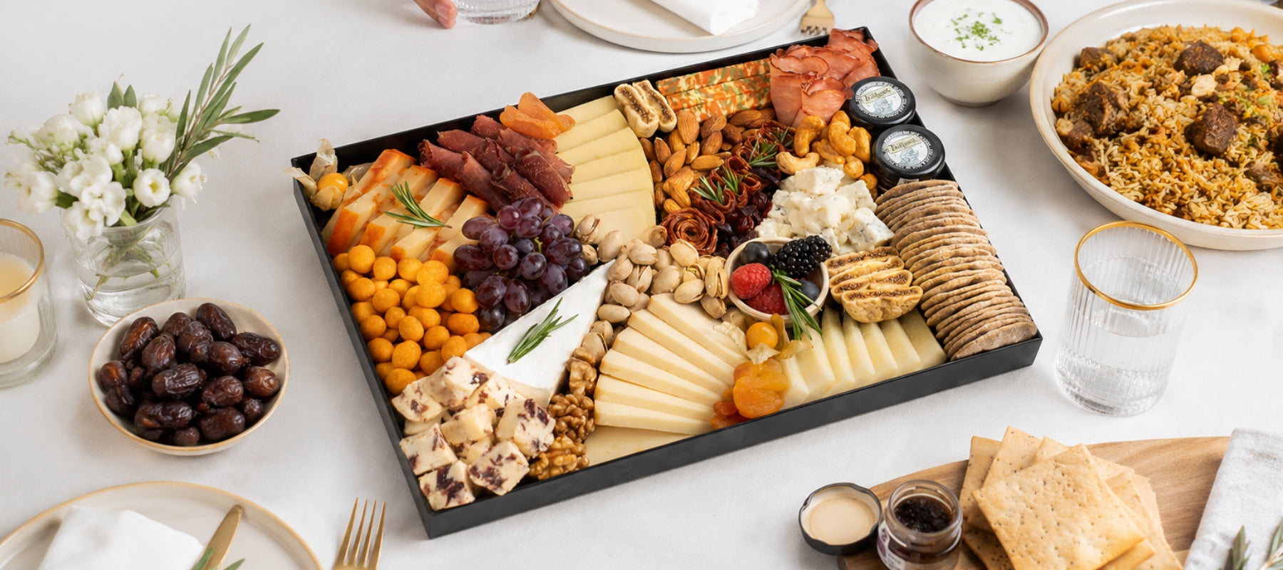The Cheese Man Eid charcuterie board featuring artisan cheeses, halal cold cuts, crackers, dates, nuts, grapes, dried fruits, and gourmet accompaniments for luxury Eid gatherings and cheese platters in Dubai. Available for same day delivery in Dubai. Free delivery over AED249.
