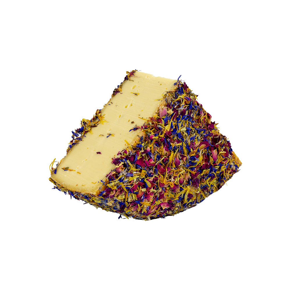 The Cheese Man flower-coated cheese, a soft artisanal cheese covered in edible dried flowers, offering a delicate creamy texture and refined floral presentation for gourmet cheese boards.
