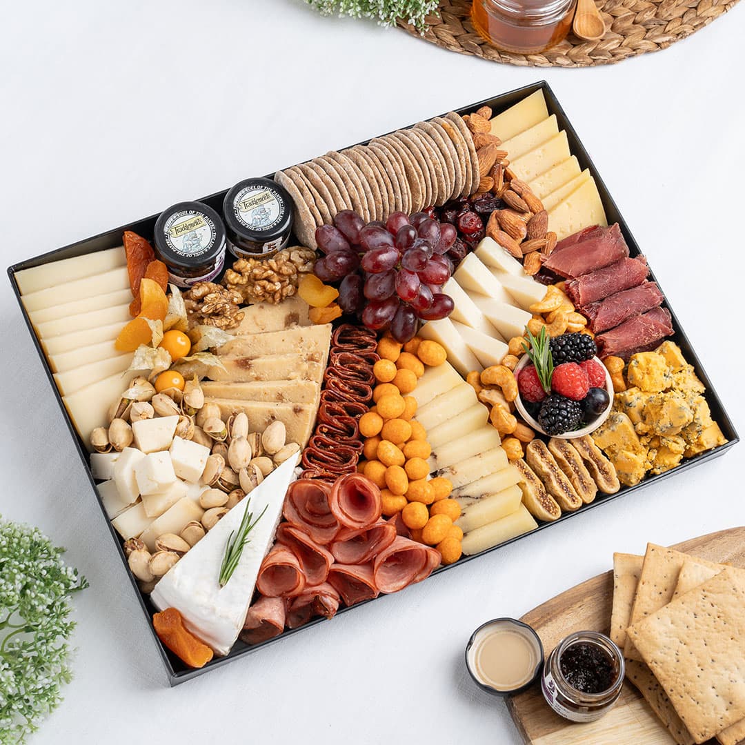 The Cheese Man French cheese platter featuring brie, blue cheese, cheddar cubes, artisan cheeses, halal cold cuts, crackers, nuts, dried fruits, and gourmet accompaniments, curated for luxury cheese boards and charcuterie platters in Dubai. Available for same day delivery in Dubai. Free delivery over AED249.