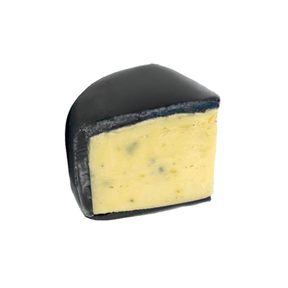 The Cheese Man matured truffle cheddar cheese, a rich artisan cheddar infused with black truffle, showcasing premium aged cheese with deep earthy flavour and gourmet cheese selection.