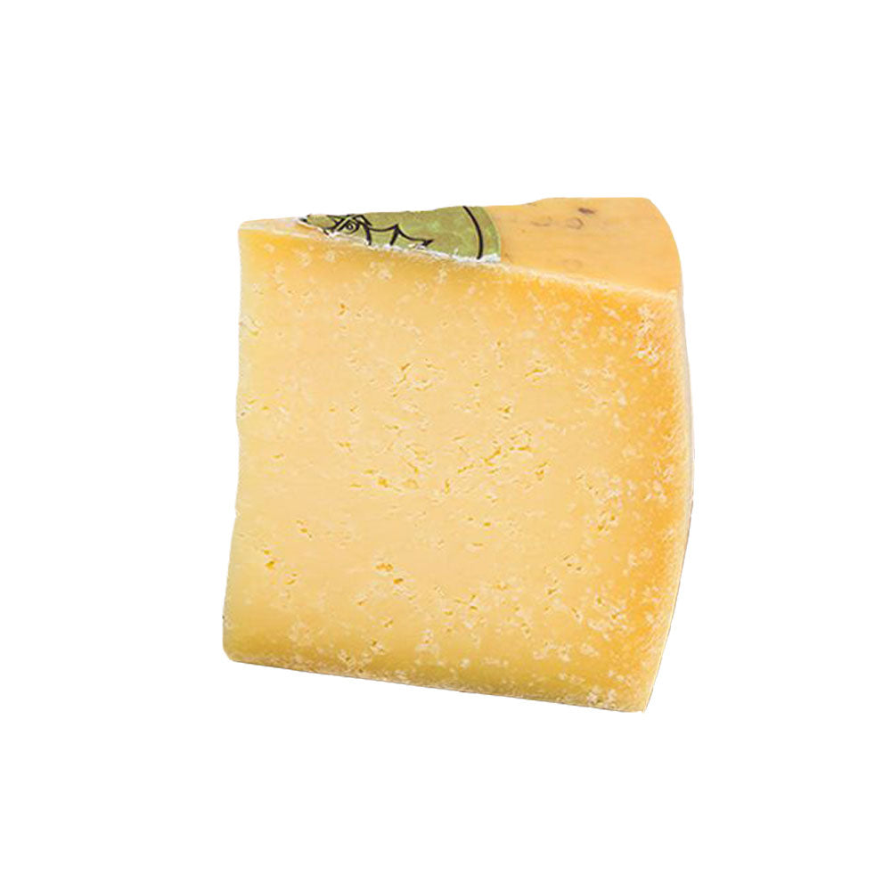 The Cheese Man Portugal 12 months aged cheese, a firm artisanal cheese with a deep nutty flavour, crystalline texture, and rich complexity, showcasing premium European aged cheese craftsmanship.