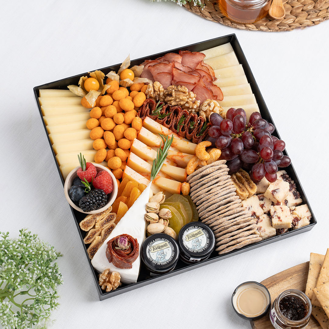 The Cheese Man gourmet signature cheese platter featuring artisan cheeses, halal cold cuts, crackers, dried fruits, nuts, and accompaniments, curated for luxury charcuterie boards and cheese board delivery in Dubai.