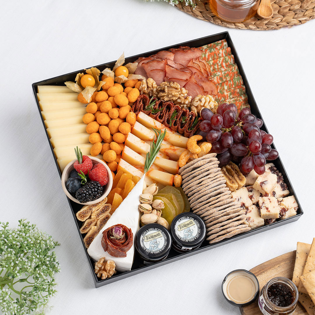 The Cheese Man gourmet signature cheese platter featuring artisan cheeses, halal cold cuts, crackers, dried fruits, nuts, and accompaniments, curated for luxury charcuterie boards and cheese board delivery in Dubai.