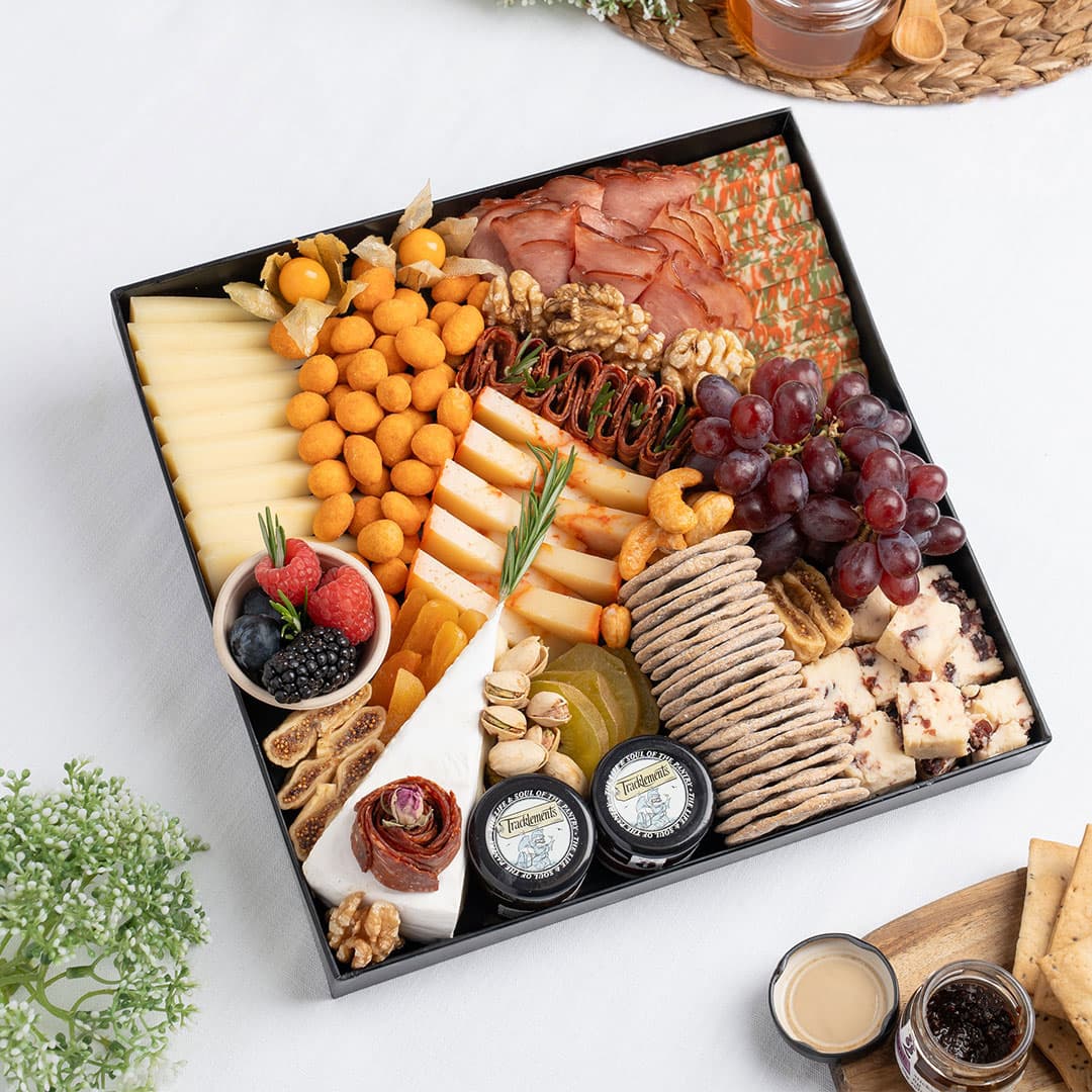 The Cheese Man gourmet signature cheese platter featuring artisan cheeses, halal cold cuts, crackers, dried fruits, nuts, and accompaniments, curated for luxury charcuterie boards and cheese board delivery in Dubai.