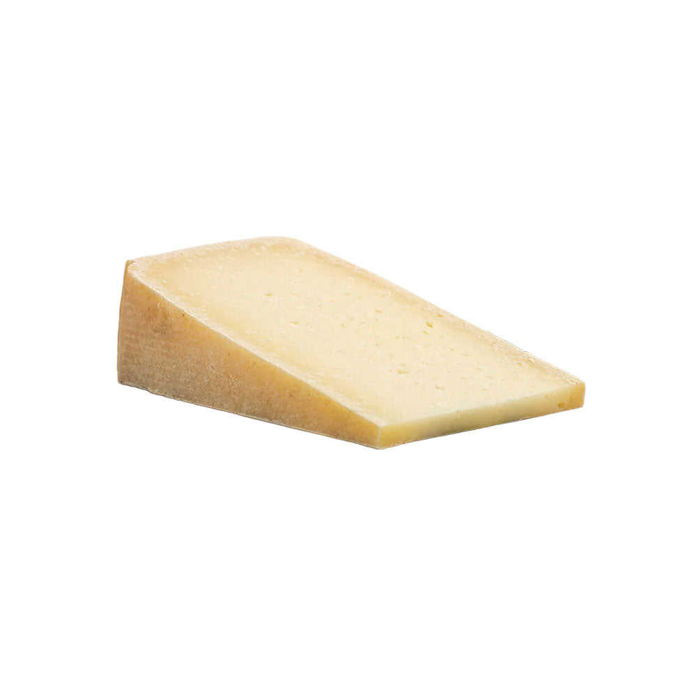 The Cheese Man Spanish aged sheep cheese, a firm artisanal cheese with a rich, nutty flavour and slightly crumbly texture, representing traditional Manchego-style sheep’s milk cheese for gourmet cheese boards.