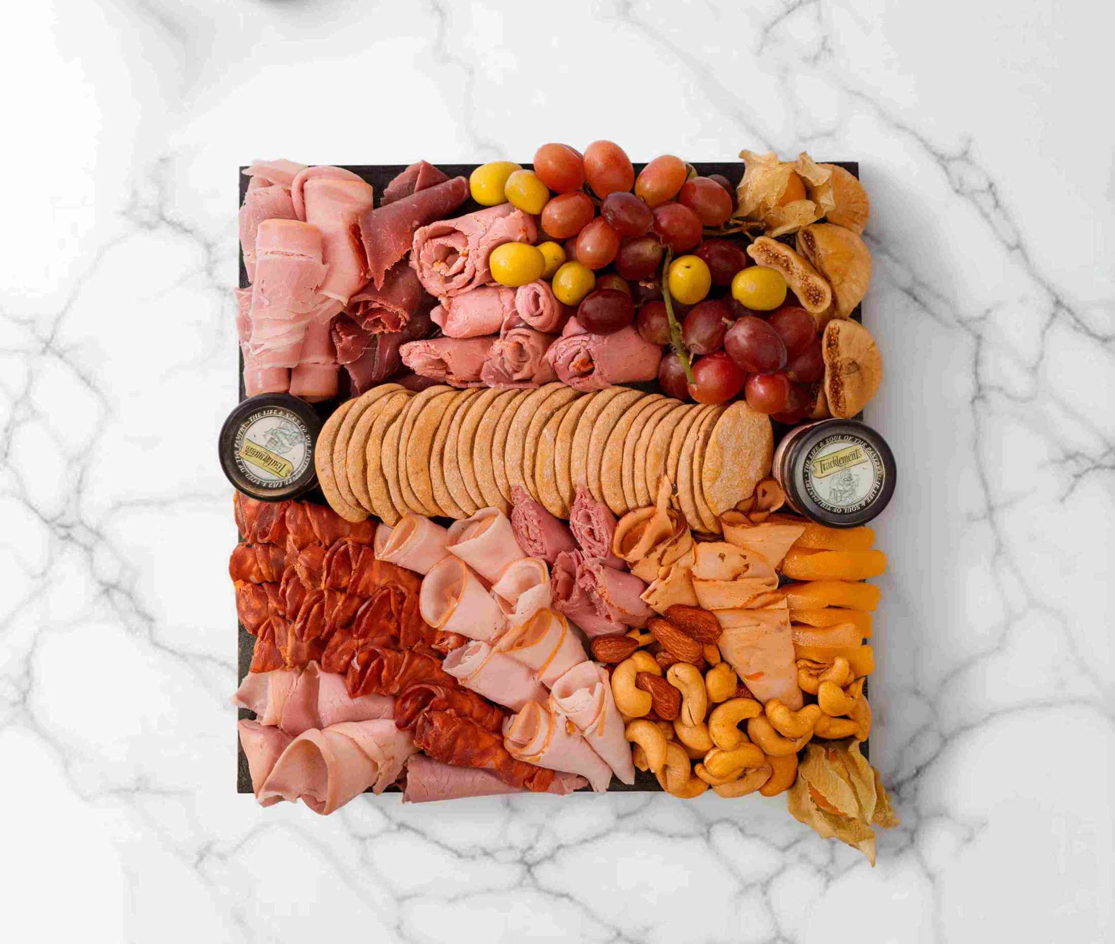 Halal charcuterie board with assorted meats, nuts, and accompaniments, serving 2–4 people - AED 209.00 - The Cheese Man Cheese Platter