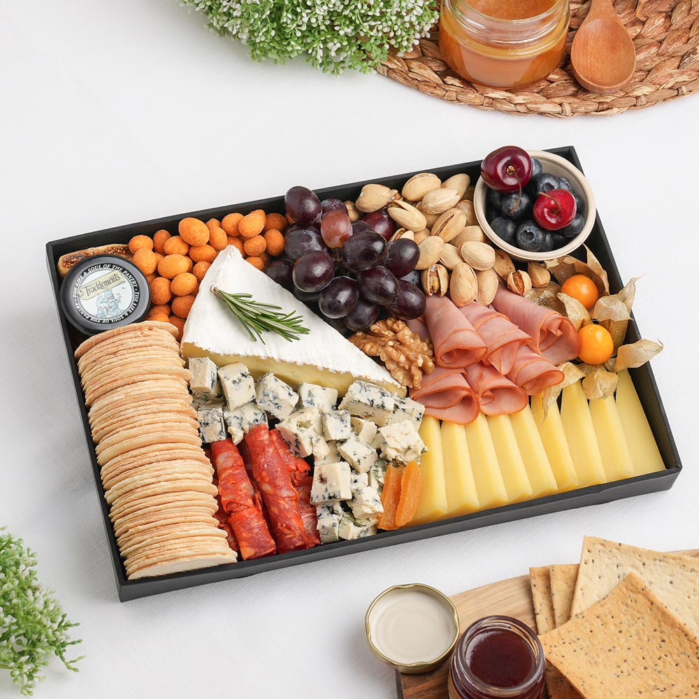 The French Cheese Board Small is an artisan cheeseboard showcasing Brie De Meaux, Comte 8 Months AOP, Bleu D'Auvergne, quality deli meats, and fresh seasonal accompaniments, beautifully presented for sharing with family and friends. Explore gourmet cheese boards Dubai from The Cheese Man UAE. Freshly prepared and delivered across the UAE.