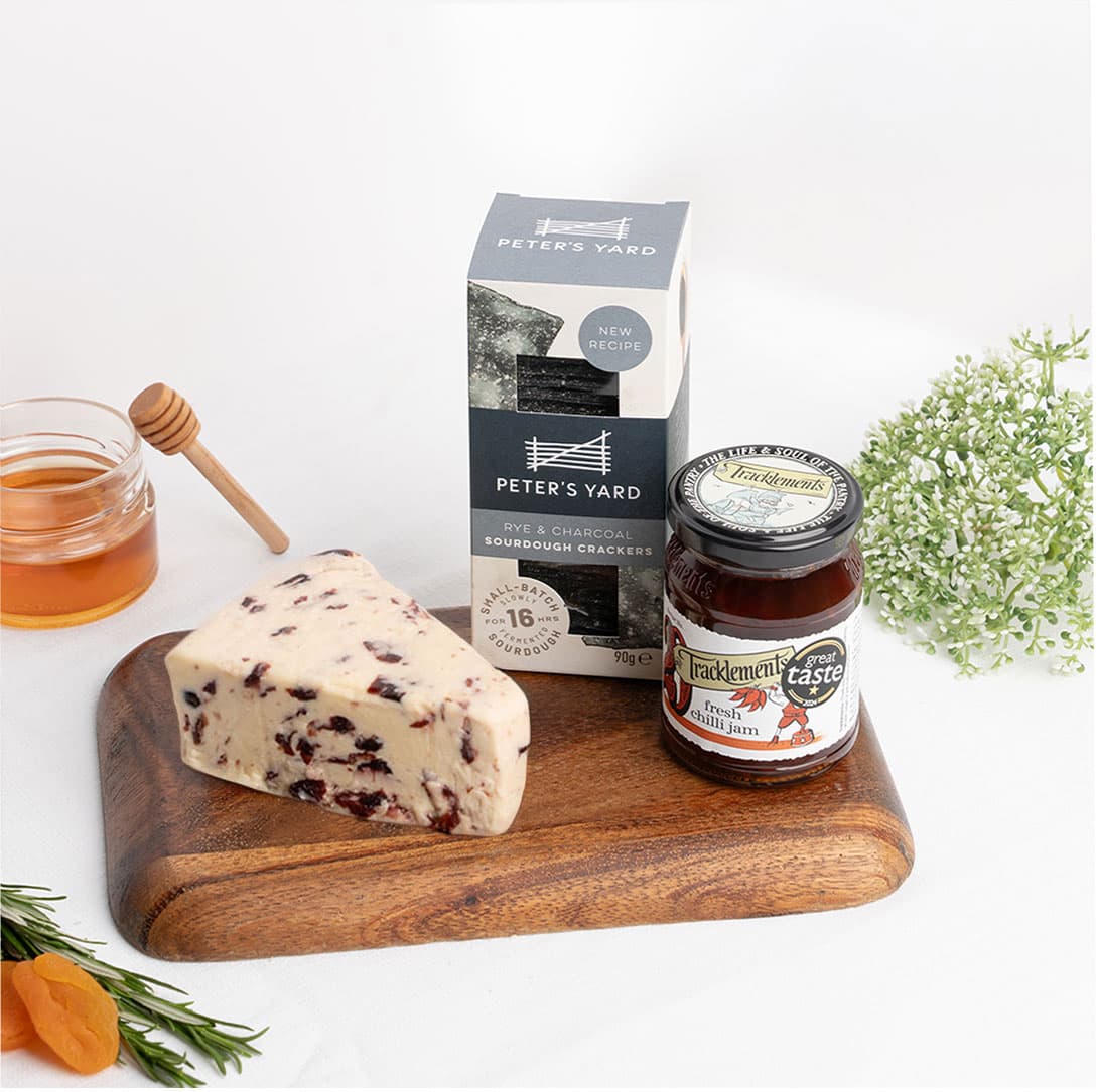 A luxury cheese gift bundle featuring fruity Wensleydale, artisan crackers, and gourmet chilli jam for memorable occasions.Available for same-day delivery in Dubai.