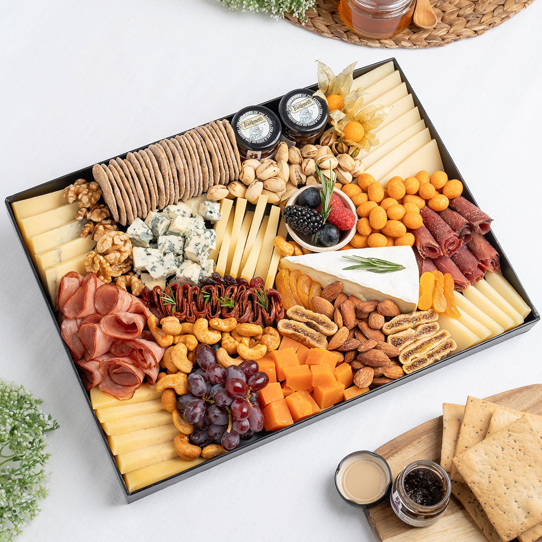 The Cheese Man French cheese platter featuring brie, blue cheese, cheddar cubes, artisan cheeses, halal cold cuts, crackers, nuts, dried fruits, and gourmet accompaniments, curated for luxury cheese boards and charcuterie platters in Dubai. Available for same day delivery in Dubai. Free delivery over AED249.