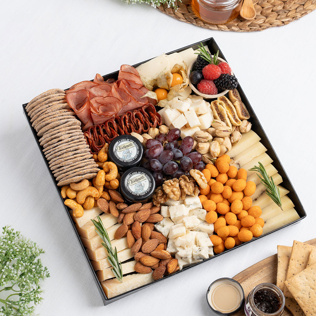 The Cheese Man Italian cheese platter featuring artisan Italian cheeses, halal cold cuts, crackers, nuts, figs, grapes, and gourmet accompaniments, curated for luxury charcuterie boards and cheese platters. Available for delivery across UAE.
