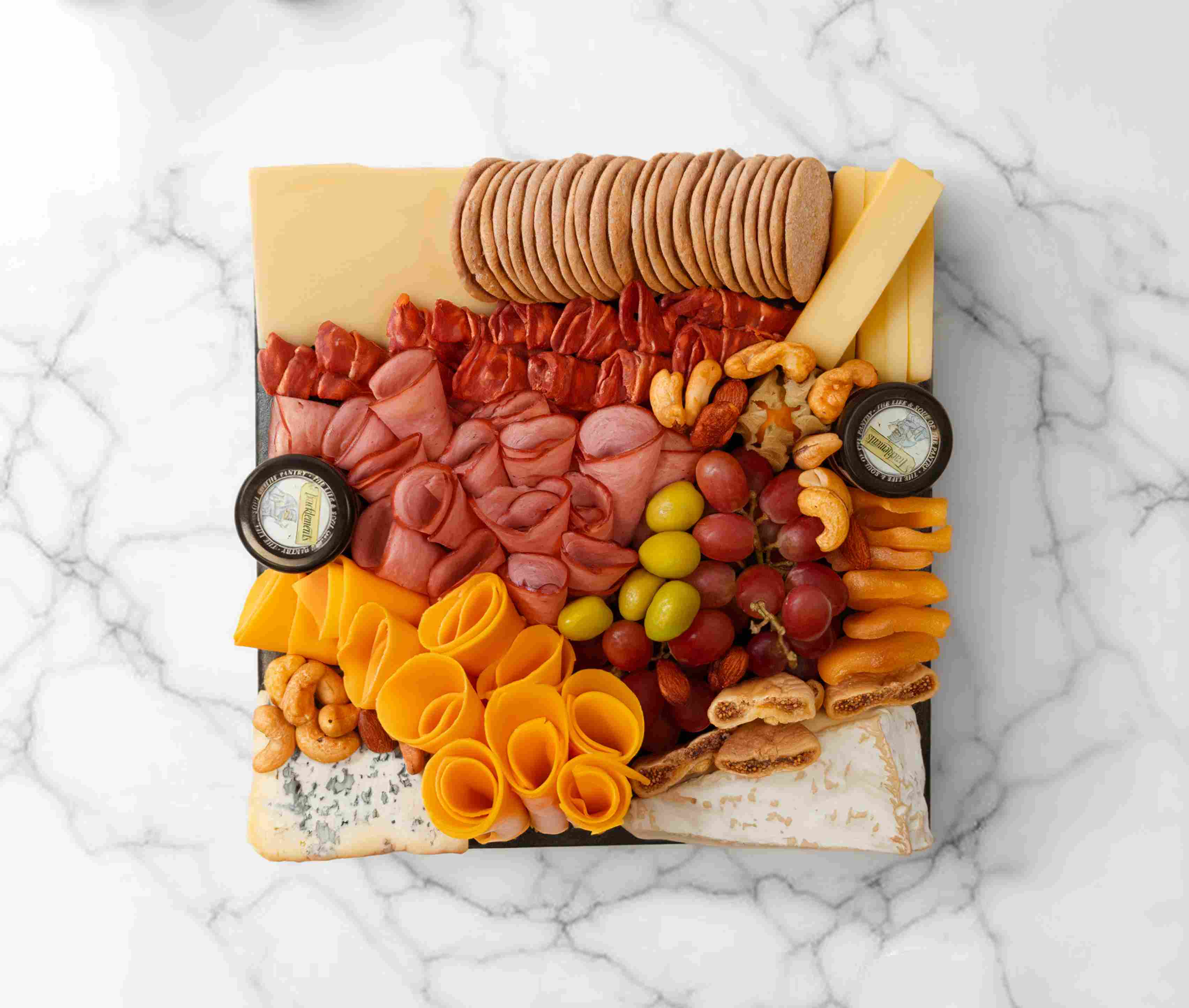 French cheeseboard with traditional French cheeses and accompaniments, serving 2–4 people.