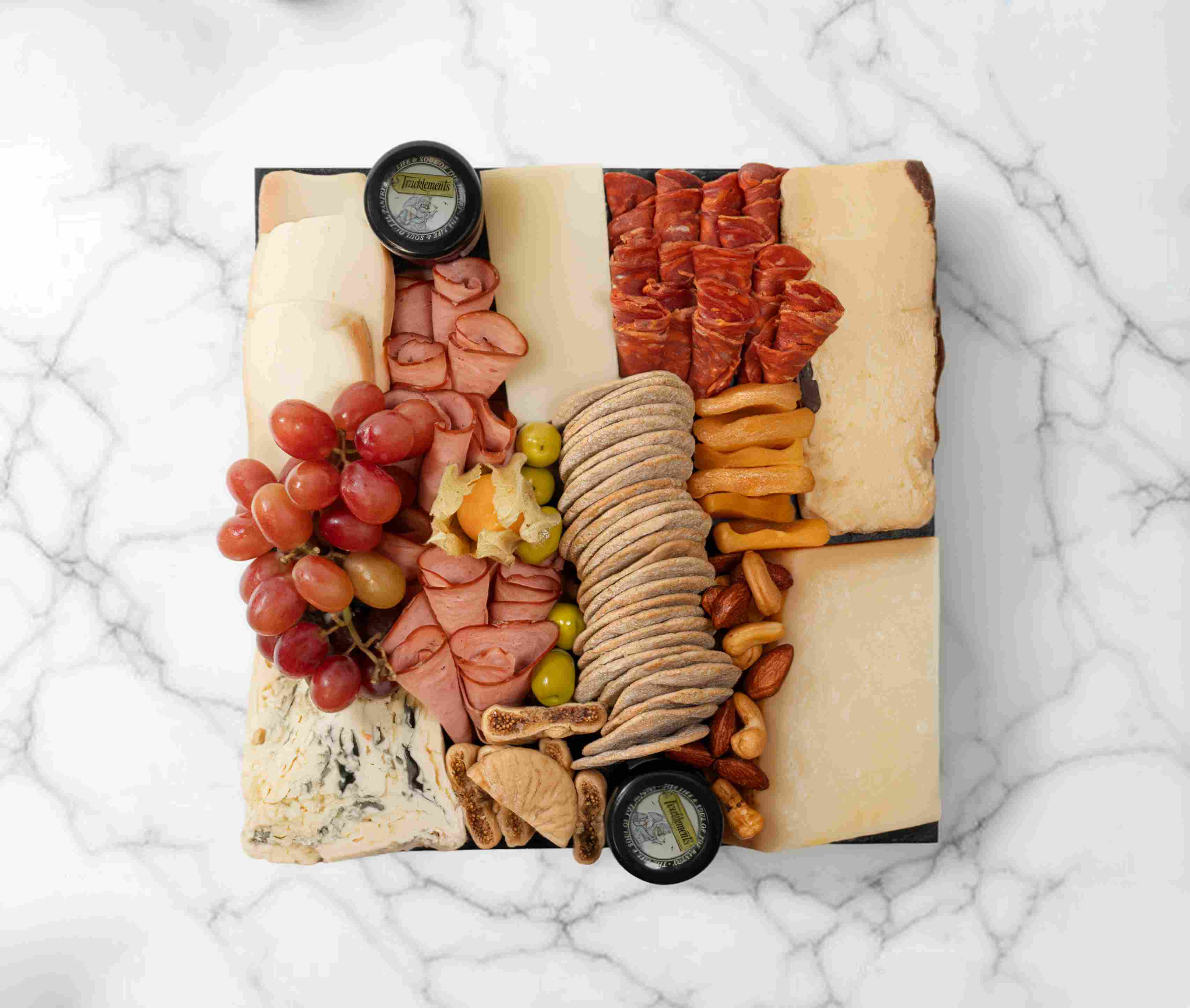 Italian cheeseboard with classic Italian cheeses, meats, and accompaniments, serving 2–4 people.