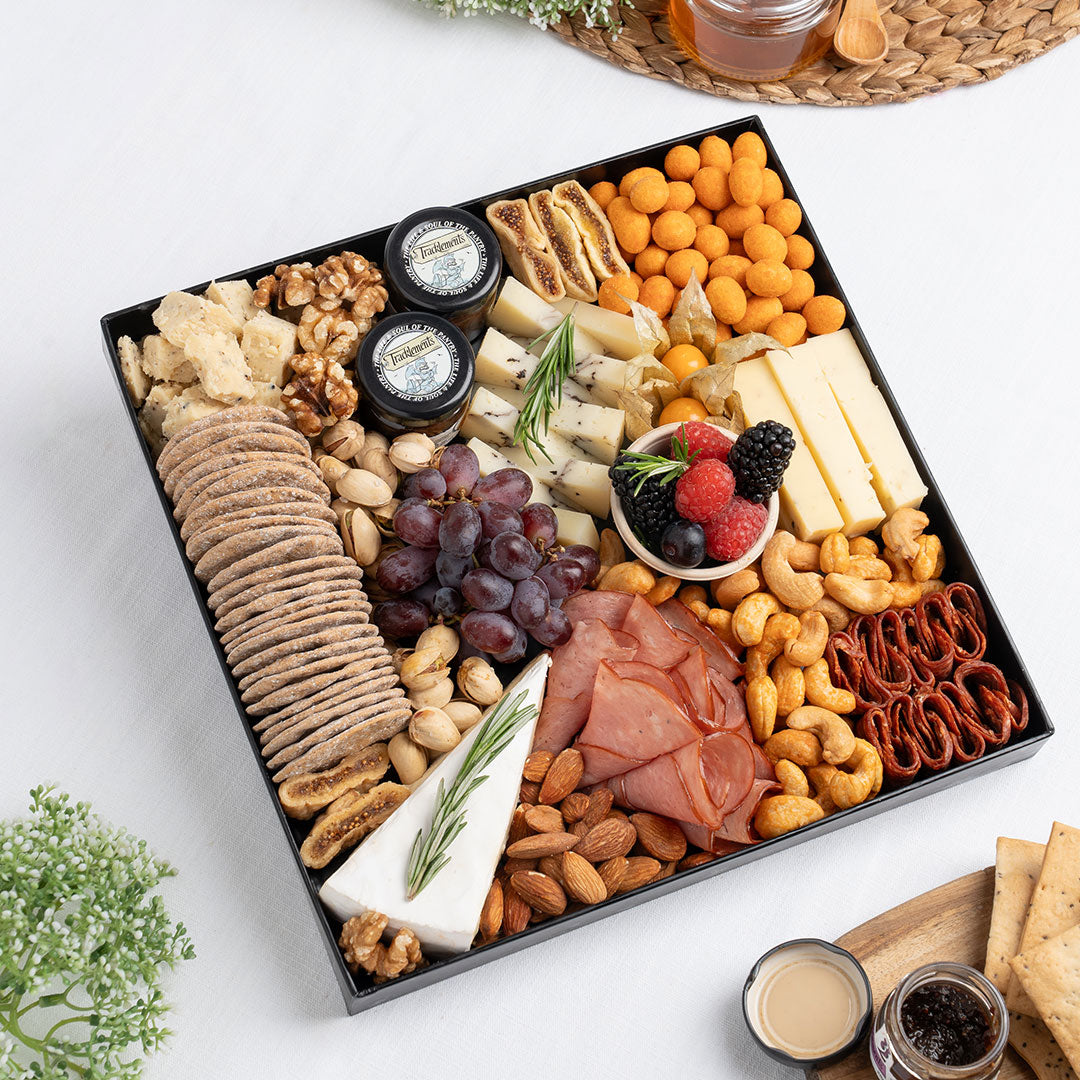 The Cheese Man gourmet cheese platter featuring truffle cheese, artisan cheeses, halal cold cuts, crackers, nuts, grapes, figs, and gourmet accompaniments, curated for luxury charcuterie boards and cheese platters. Available for same day delivery in Dubai. Free delivery over AED249.