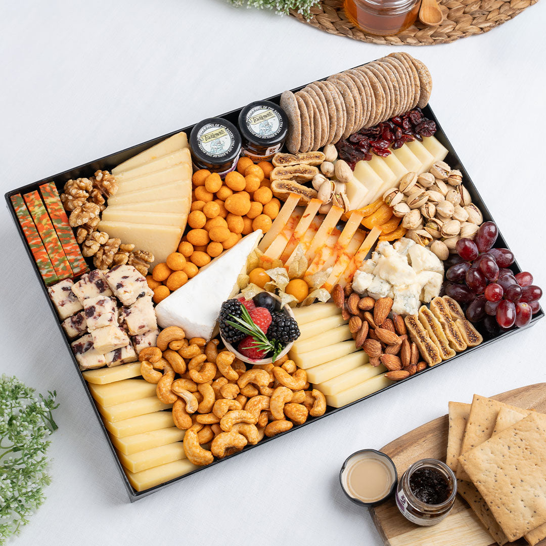 The Cheese Man vegetarian cheese platter featuring artisan cheeses, cranberry cheese, brie, blue cheese, crackers, nuts, grapes, dried fruits, and gourmet accompaniments, curated for luxury cheese boards and grazing platters in Dubai. Available for delivery across UAE. Free delivery over AED249.